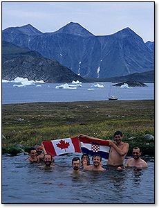 crew members relaxing in a natural hot spring