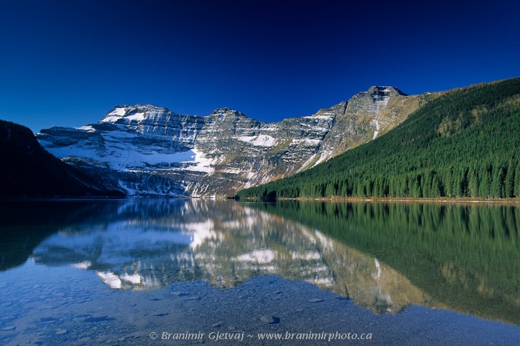 Morning reflection on Cameron Lake, Waterton Lakes National Park, Alberta