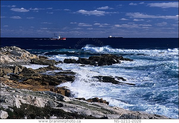 boats near rocky shoreline afetr storm, Nova Scotia