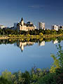 Saskatoon city skyline with Delta Bessborough hotel reflecting in South Saskatchewan river
