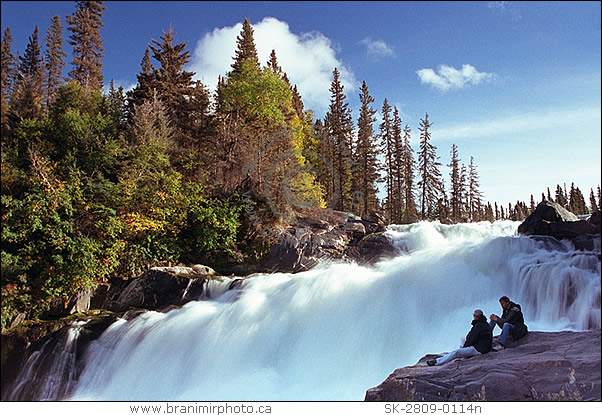 hikers admire Nistowiak Falls, Churchill River